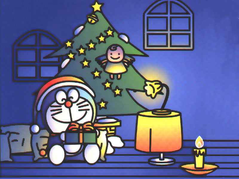 Chú mèo máy Doremon ngồi cạnh cây thông Giáng Sinh